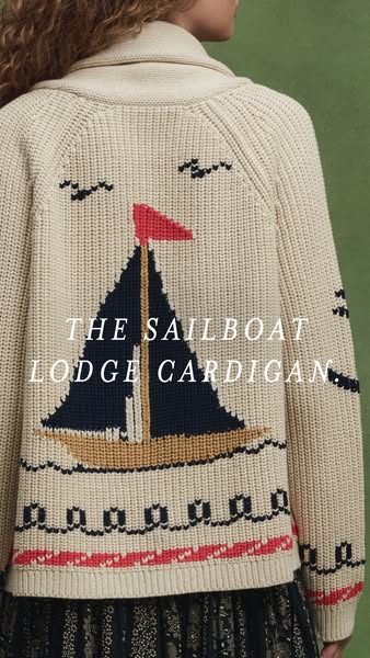 This image ad features a Sailboat Lodge Cardigan. The back of the cardigan is shown with the name of the item centered o