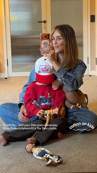 This ad features a photo of a woman and child sitting on the floor, surrounded by Toy Story-themed clothing and toys. Th