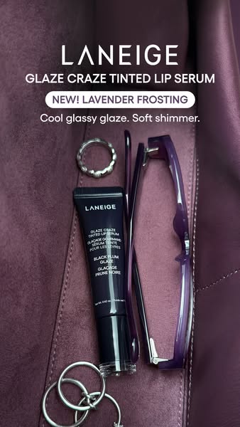 This ad showcases the Laneige Glaze Craze Tinted Lip Serum in a flatlay format, emphasizing its new Lavender Frosting co