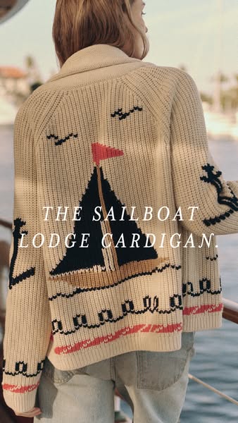 This image ad highlights the Sailboat Lodge Cardigan, showing its nautical-themed design and emphasizing the brand's