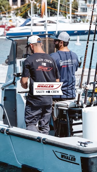 The ad features two men standing on a boat, both wearing t-shirts from the Salty Crew brand. The primary focus is on sho