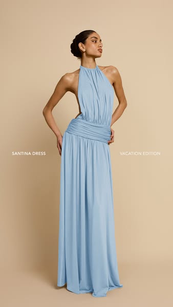 This image ad showcases a powder blue dress with a halter neckline and ruched waist, ideal for vacation wear.