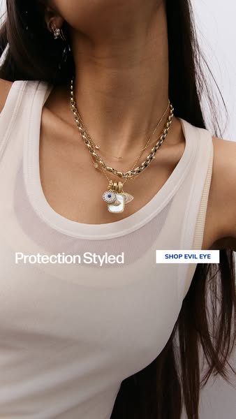 This image ad showcases a model wearing a necklace with an 'evil eye' design, emphasizing the style and protecti