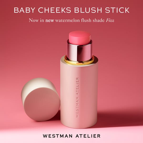 This is an ad for Westman Atelier's Baby Cheeks Blush Stick. It showcases the product against a pink background.