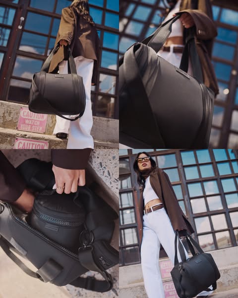 This ad features a woman walking on the street with a Dagne Dover Landon Carryall bag.