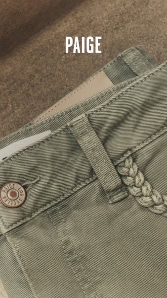 This image ad features a close up shot of denim pants by PAIGE with braided belt loops. The brand name appears at the to