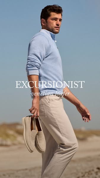 This ad for Venetian Loafers features a man walking on the beach while holding a pair of the shoes.
