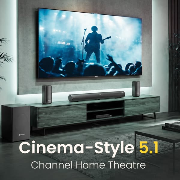 This ad showcases a home theatre audio system by showing the different components placed within a living room setting, s