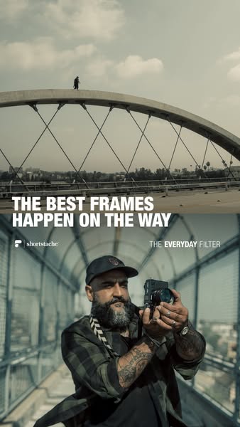 This Shortstache image ad promotes their everyday filter using a picture of a man taking a picture on a bridge.