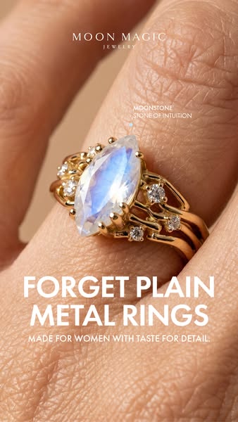 This ad for Moon Magic Jewelry features a close up of a hand wearing a gold ring with a moonstone, with a tagline saying