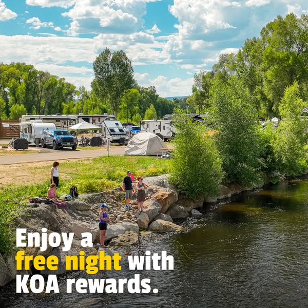 This image ad promotes KOA rewards by offering a free night. The ad features a scenic view of a KOA campground with peop