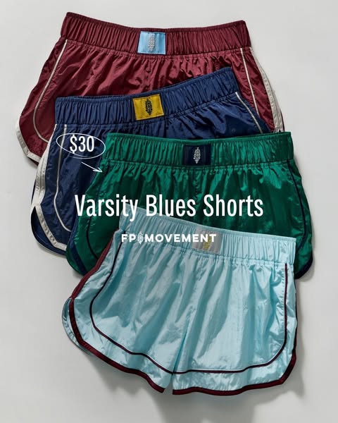 This ad features an image of four pairs of FP Movement Varsity Blues Shorts in different colors, stacked on top of each 