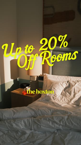This ad for The Hoxton hotel features a bedroom scene with a bright yellow headline that advertises up to 20% off rooms.
