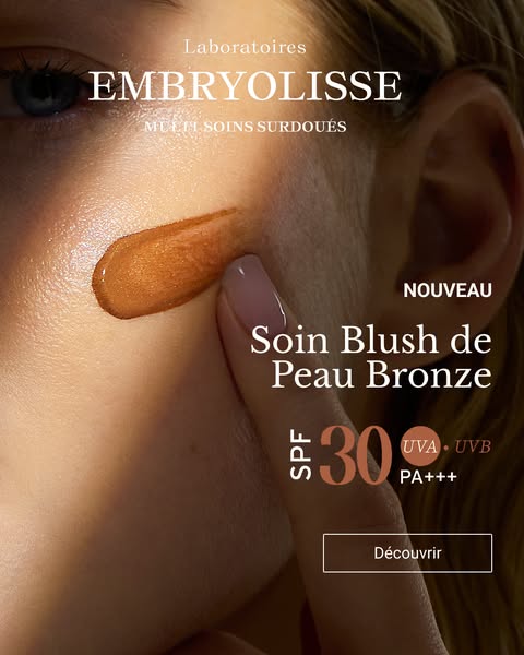 A close up image showcases Embryolisse's new bronze shade of blush. The product can be seen applied to the cheek of 