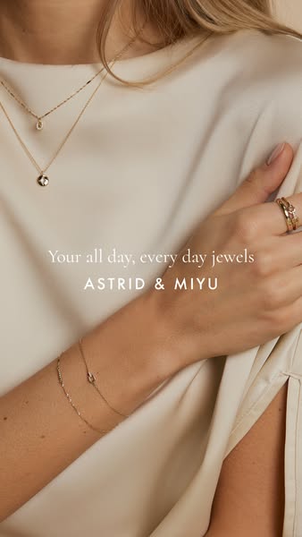 This ad is for Astrid & Miyu jewelry. The ad features a close-up shot of a person wearing various pieces of jewelry,