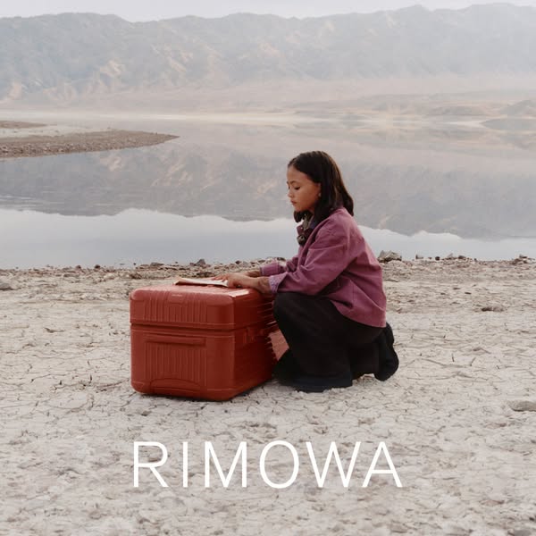 This ad features a young girl with a Rimowa suitcase in a desert landscape. The ad focuses on the brand's image of t