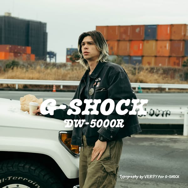 This ad features a young man leaning against a white off-road vehicle with a cup and paper bag on the hood. He is wearin