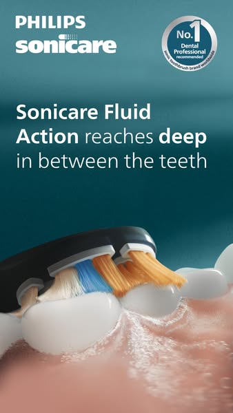 This ad showcases a Philips Sonicare toothbrush reaching deep between the teeth. It uses the slogan "Sonicare Fluid