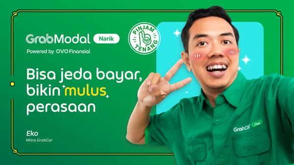 The ad promotes GrabModal, powered by OVO Finansial, and features a man in a GrabCar Plus shirt making a peace sign, con
