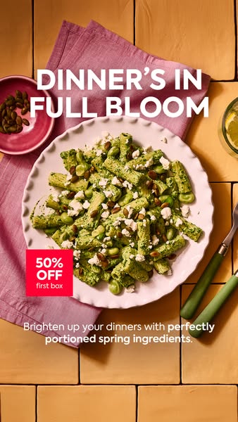 This image ad promotes a meal kit delivery service, featuring a pasta dish with spring ingredients and offering a 50% di