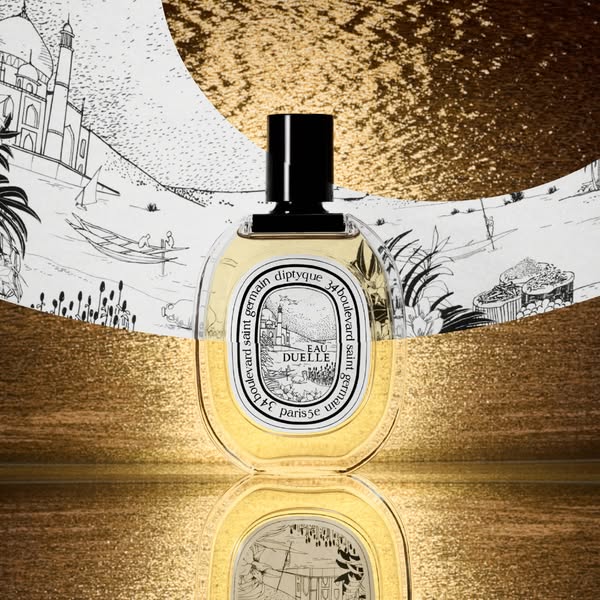 A still shot features a Diptyque fragrance against a patterned background.