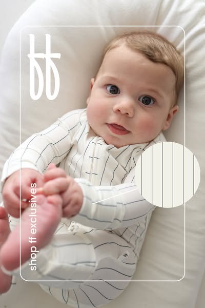 An image ad featuring a baby wearing an exclusive striped pajama set, promoting a baby clothing brand.