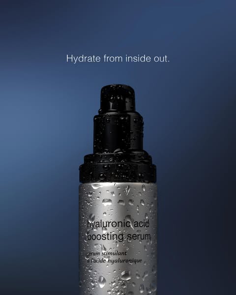 This ad features a close-up of a bottle of hyaluronic acid boosting serum with water droplets on the bottle. The headlin