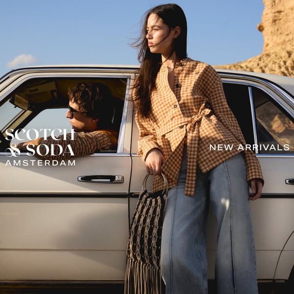 This ad for Scotch & Soda features two models, one leaning against a vintage car and another in the driver's sea