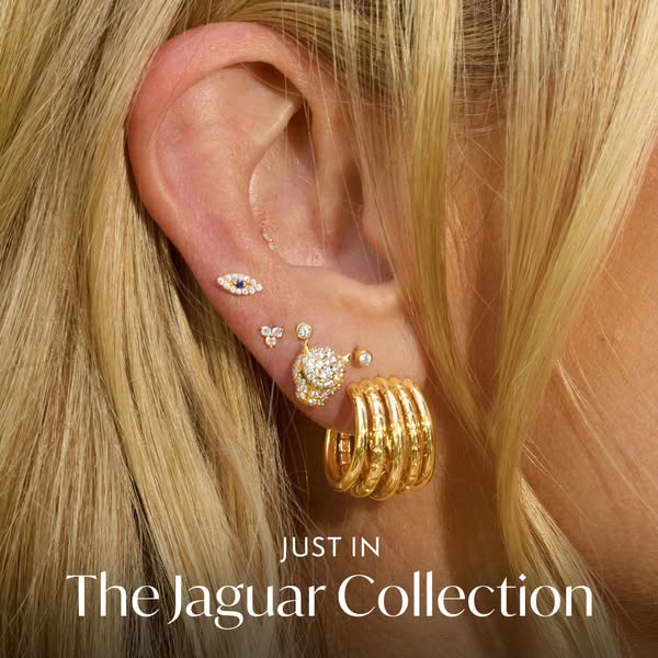 This ad features an array of earring styles showcased on a woman's ear and upper cheek. The ad promotes 'The Jag