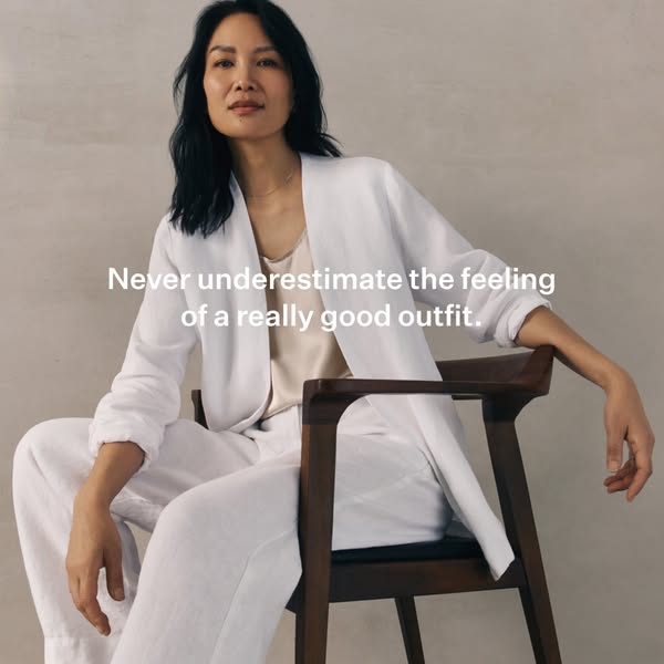 This ad features a woman sitting in a chair while wearing a white blazer and matching pants. The ad's copy suggests 