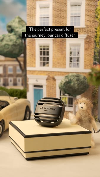 This image ad for Jo Malone London features a car diffuser set in a miniature diorama to emphasize it as a giftable item