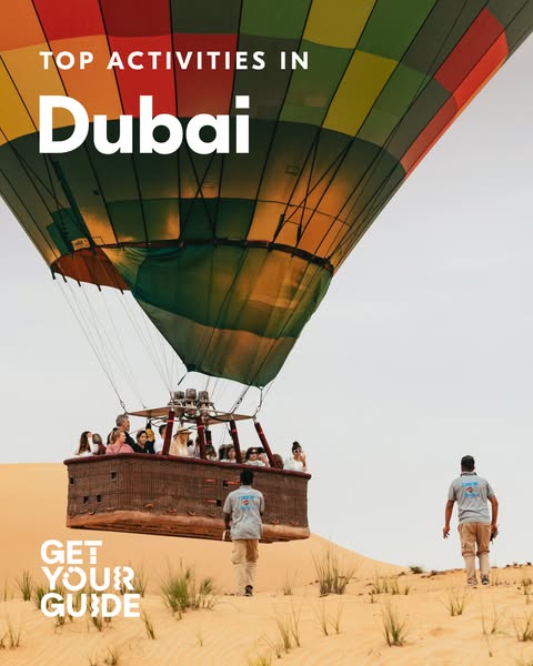 This image ad promotes Get Your Guide's hot air balloon tour in Dubai. The ad features a hot air balloon over a dese