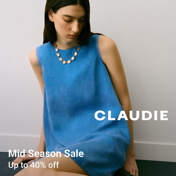 This image ad for Claudie features a model wearing a denim dress and promotes the brand's mid-season sale offering u