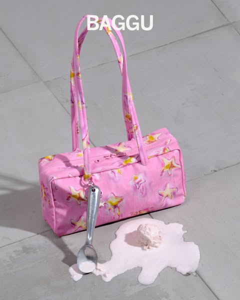 A still-life image features a BAGGU bag lying next to a melted scoop of ice cream.