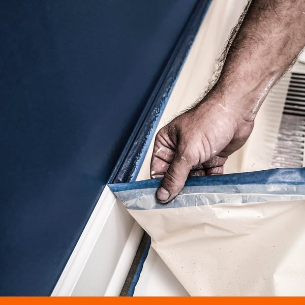 This ad shows someone applying painter's tape to a wall. It is likely meant to show a product that makes painting a 