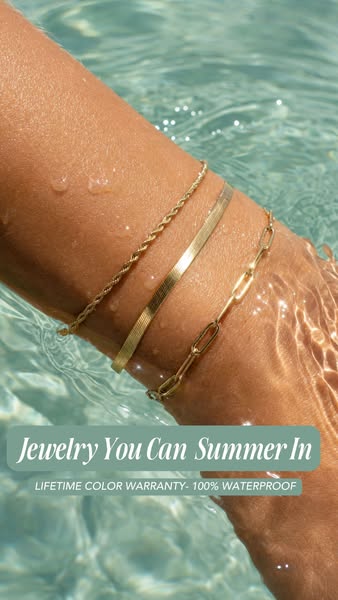 This image ad showcases three gold-colored bracelets worn on a person's arm while they are in water. The text overla