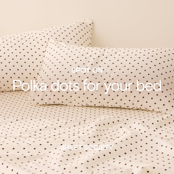This is a simple image ad for Sheet Society bedding. The ad features a set of white sheets with brown polka dots.