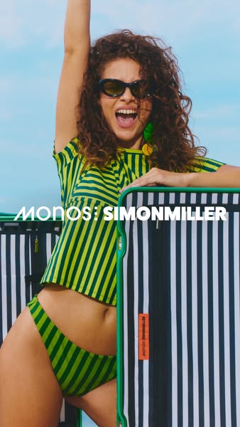 This ad features a woman in a matching striped outfit standing next to a Monos suitcase. The ad is promoting the Monos b