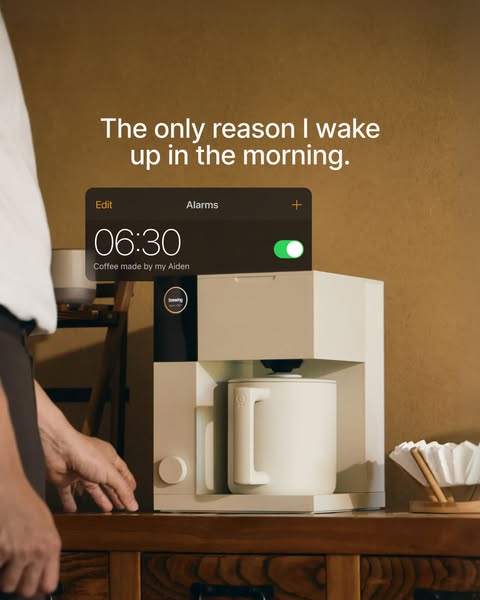 This ad showcases a sleek, modern coffee maker, positioning it as the highlight of one's morning through a close-up 