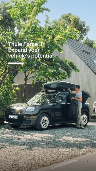 This ad showcases the Thule Force 3 roof box on a car in a residential setting, emphasizing its potential to expand a ve