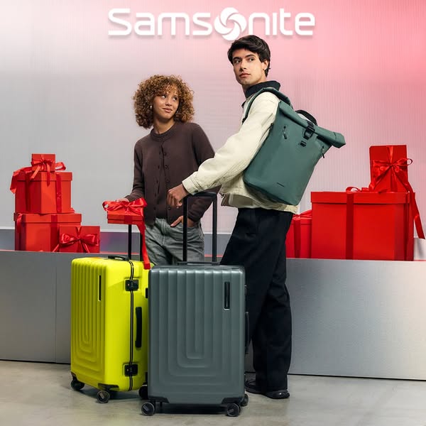 This ad showcases Samsonite luggage and backpacks, presenting them as ideal gifts for the holiday season. Two young adul