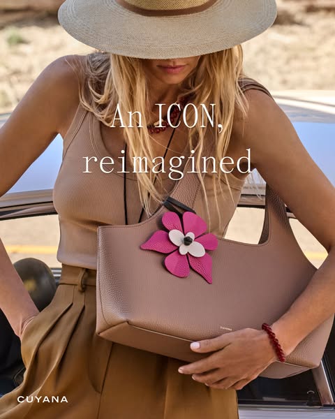 This ad features a woman standing in front of a car holding a Cuyana handbag. The ad emphasizes the handbag's iconic