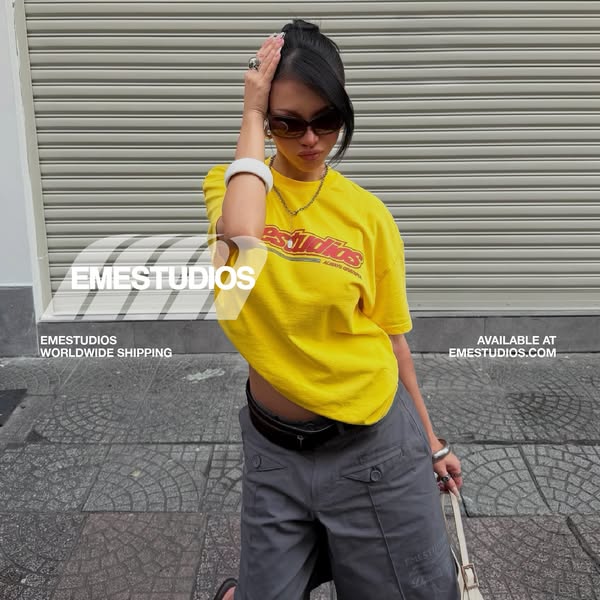 This image ad features a model wearing a yellow t-shirt with the brand name and website displayed.