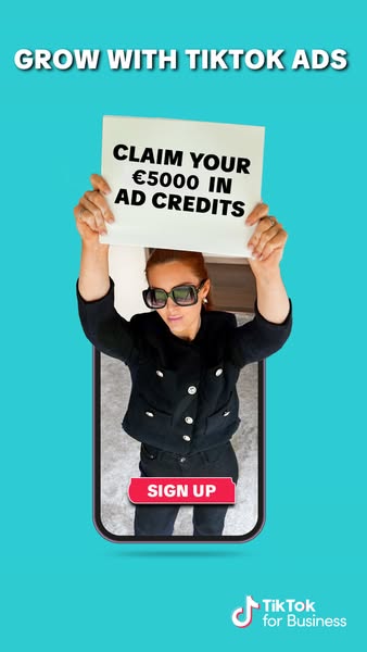 This TikTok ad promotes using TikTok ads by offering a credit incentive and features a woman holding a sign.