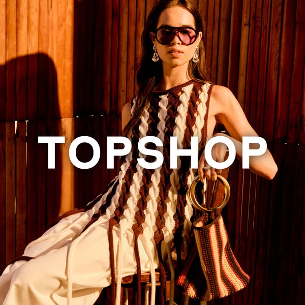 This Topshop ad showcases a model wearing a cream-and-brown colored knit dress and carrying a coordinating knit purse. T