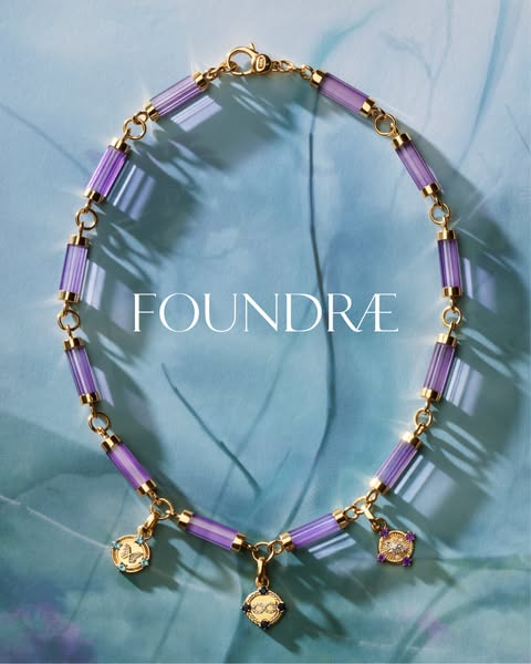 This ad features Foundrae jewelry. The image shows the product in a lifestyle setting. The necklace is the main focus an