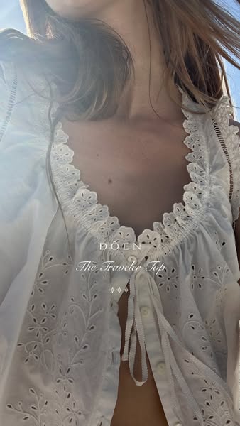 The image features a woman wearing a white top from the brand DÔEN. The focal point is on the product, highlighting its 