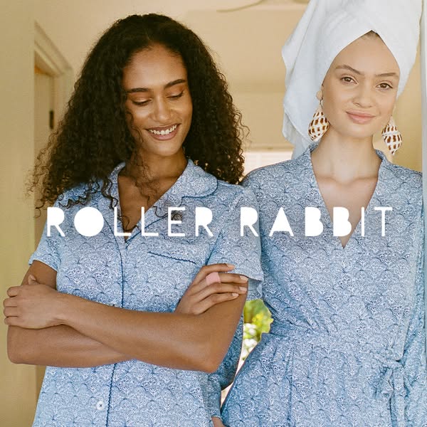 This ad features two women modeling Roller Rabbit brand pajamas and a robe. The lifestyle image promotes the brand's