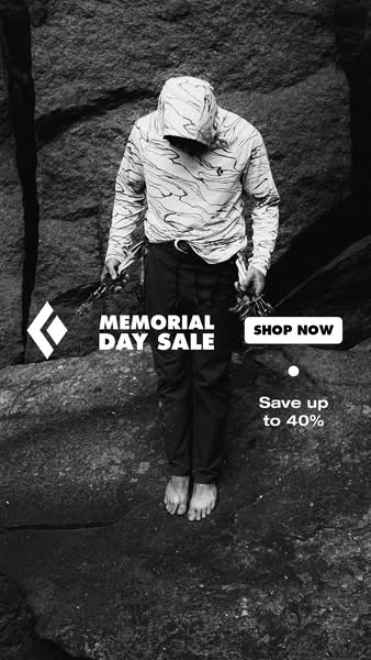 This Black Diamond ad features a black and white image of a person wearing a hooded long sleeve shirt and pants while ba