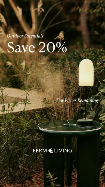 This ad promotes Ferm Living's outdoor essentials, highlighting a table lamp and offering a 20% discount.